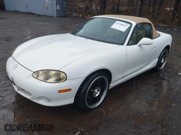 2002 Mazda MX-5 Miata Cloth z VIN JM1NB353420221527, wystawiony jako IAAI lot #41909623 z przebiegiem 90 260 mil mil oraz . Historia ofert i sprzedaży dostępna na DreamBid. Obrazek 2.