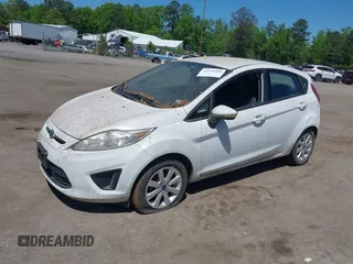 2013 Ford Fiesta SE with VIN 3FADP4EJ0DM109816, listed as a IAAI auction lot 42119360 with 164,397 mi miles and . Bid and sale history available at DreamBid. Image 2.
