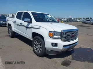 2018 GMC Canyon z VIN 1GTG5EE10J1207658, wystawiony jako IAAI lot #42282571 z przebiegiem Nie podano mil oraz . Historia ofert i sprzedaży dostępna na DreamBid. Obrazek 1.