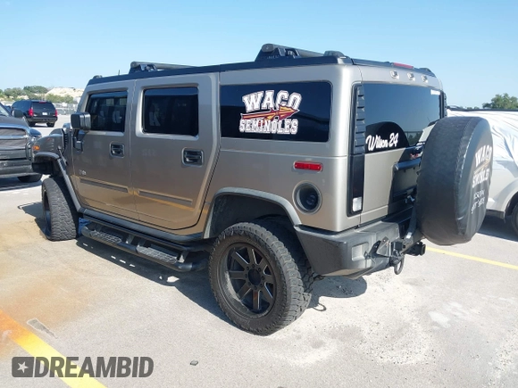 2003 Hummer H2 with VIN 5GRGN23U43H125114, listed as a IAAI auction lot 42160986 with 157,776 mi miles. Bid and sale history available at carsss.com. Image 3.