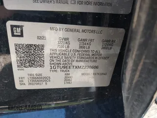2021 GMC Sierra 1500 AT4 with VIN 1GTU9EETXMZ230606, listed as a IAAI auction lot 41599778 with 128,745 mi miles. Bid and sale history available at carsss.com. Image 9.