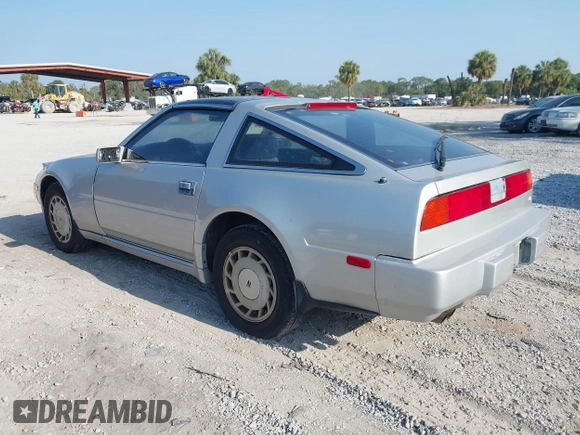 1987 Nissan 300ZX z VIN JN1HZ14S6HX214121, wystawiony jako IAAI lot #42204712 z przebiegiem 218 637 mil mil oraz . Historia ofert i sprzedaży dostępna na DreamBid. Obrazek 3.