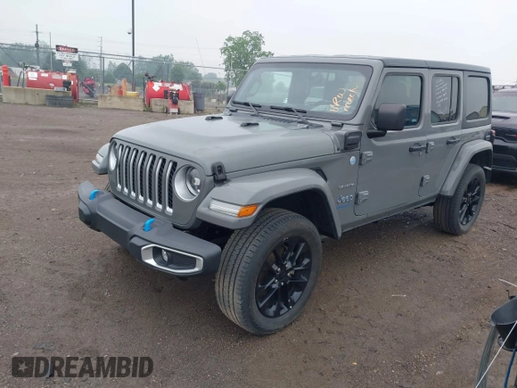2023 Jeep Wrangler Sahara with VIN 1C4JJXP6XPW698886, listed as a IAAI auction lot 42439690 with 41,787 mi miles and . Bid and sale history available at DreamBid. Image 2.