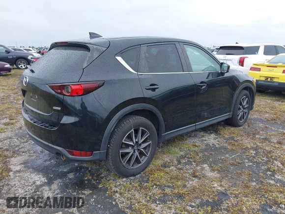 2018 Mazda CX-5 Touring with VIN JM3KFACM0J0315739, listed as a IAAI auction lot 40516262 with 60,727 mi miles. Bid and sale history available at carsss.com. Image 4.