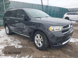 2013 Dodge Durango Crew z VIN 1C4SDJDT7DC684766, wystawiony jako IAAI lot #41277670 z przebiegiem 115 555 mil mil oraz . Historia ofert i sprzedaży dostępna na DreamBid. Obrazek 1.