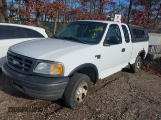 2003 Ford F-150 XL with VIN 2FTRX18W43CA62452, listed as a IAAI auction lot 41497879 with 125,828 mi miles. Bid and sale history available at carsss.com. Image 2.