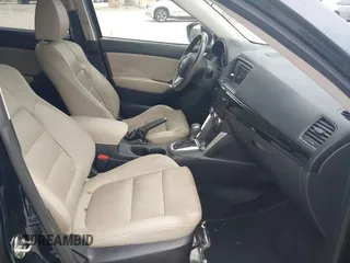 2014 Mazda CX-5 Grand Touring with VIN JM3KE2DY8E0425258, listed as a IAAI auction lot 42179452 with 132,137 mi miles. Bid and sale history available at carsss.com. Image 5.
