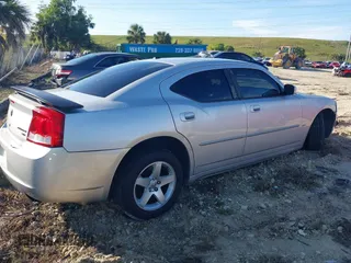 2010 Dodge Charger SXT with VIN 2B3CA3CV7AH312057, listed as a IAAI auction lot 38385104 with 178,259 mi miles and . Bid and sale history available at carsss.com. Image 4.