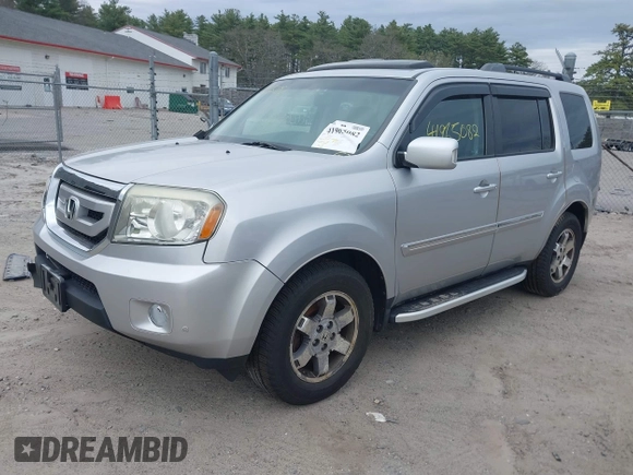 2011 Honda Pilot Touring with VIN 5FNYF4H90BB022354, listed as a IAAI auction lot 41965082 with 126,505 mi miles and . Bid and sale history available at carsss.com. Image 2.