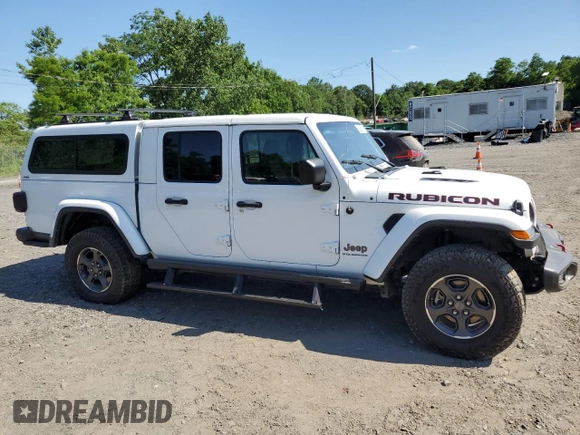 2023 Jeep Gladiator Rubicon with VIN 1C6JJTBG9PL546437, listed as a Copart auction lot 62536575 with 14,106 mi miles and Salvage title. Bid and sale history available at DreamBid. Image 4.