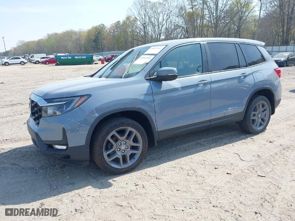 2022 Honda Passport EX-L with VIN 5FNYF8H51NB030262, listed as a IAAI auction lot 41911194 with 56,877 mi miles. Bid and sale history available at carsss.com. Image 2.