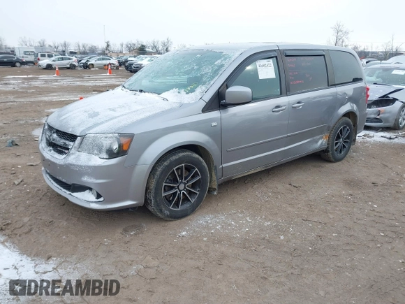 2014 Dodge Grand Caravan SXT with VIN 2C4RDGCGXER308657, listed as a IAAI auction lot 41602422 with 200,643 mi miles and . Bid and sale history available at DreamBid. Image 2.