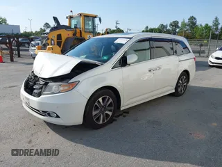 2014 Honda Odyssey Touring with VIN 5FNRL5H94EB001479, listed as a IAAI auction lot 41123678 with 147,269 mi miles and . Bid and sale history available at carsss.com. Image 19.