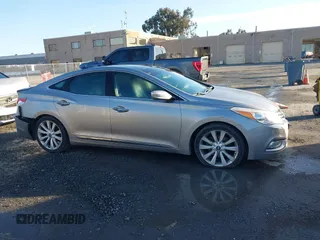 2013 Hyundai Azera z VIN KMHFH4JG3DA230844, wystawiony jako IAAI lot #41817997 z przebiegiem 129 163 mil mil oraz . Historia ofert i sprzedaży dostępna na DreamBid. Obrazek 14.