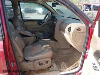2004 GMC Envoy SLT with VIN 1GKDS13SX42334503, listed as a IAAI auction lot 42038781 with 242,680 mi miles. Bid and sale history available at carsss.com. Image 5.