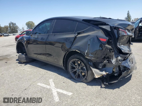 2024 Tesla Model Y Long Range with VIN 7SAYGDEE0RF123793, listed as a Copart auction lot 57177305 with 20,053 mi miles and Salvage title. Bid and sale history available at DreamBid. Image 2.