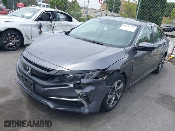 2020 Honda Civic LX z VIN 2HGFC2F60LH596396, wystawiony jako IAAI lot #42354812 z przebiegiem 62 082 mil mil oraz . Historia ofert i sprzedaży dostępna na DreamBid. Obrazek 17.