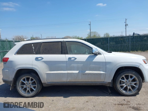 2014 Jeep Grand Cherokee Summit z VIN 1C4RJFJG3EC213145, wystawiony jako IAAI lot #41918145 z przebiegiem 176 460 mil mil oraz . Historia ofert i sprzedaży dostępna na DreamBid. Obrazek 13.