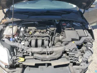 2014 Ford Focus SE z VIN 1FADP3K24EL317353, wystawiony jako Copart lot #57181215 z przebiegiem 144 495 mil mil oraz Szkoda całkowita • Salvage title. Historia ofert i sprzedaży dostępna na DreamBid. Obrazek 11.