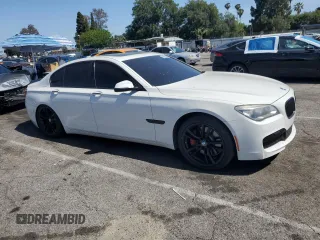 2013 BMW 7 Series 750i with VIN WBAYA8C54DC996412, listed as a Copart auction lot 56982895 with 124,258 mi miles and Salvage title. Bid and sale history available at DreamBid. Image 4.