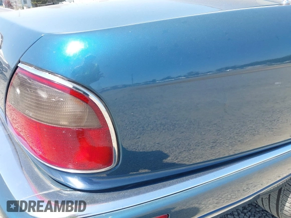 1996 Jaguar XJ with VIN SAJHX1740TC766425, listed as a IAAI auction lot 42758458 with 257,849 mi miles and . Bid and sale history available at DreamBid. Image 6.
