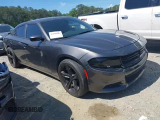 2018 Dodge Charger Daytona z VIN 2C3CDXCT4JH261021, wystawiony jako IAAI lot #42188904 z przebiegiem 79 652 mil mil oraz . Historia ofert i sprzedaży dostępna na DreamBid. Obrazek 1.