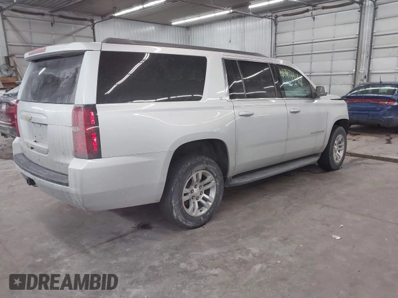 2018 Chevrolet Suburban LT z VIN 1GNSKHKC2JR201282, wystawiony jako IAAI lot #41312994 z przebiegiem 99 783 mil mil oraz . Historia ofert i sprzedaży dostępna na DreamBid. Obrazek 4.