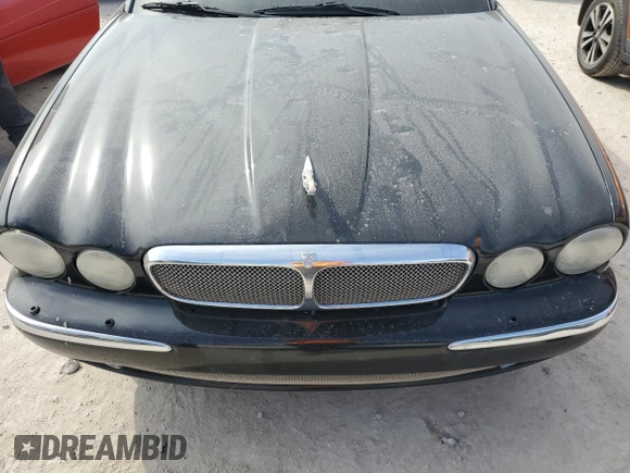 2006 Jaguar XJ with VIN SAJWA71BX6SH01193, listed as a Copart auction lot 76382034 with 0 mi miles and Salvage Title. Bid and sale history available at carsss.com. Image 11.