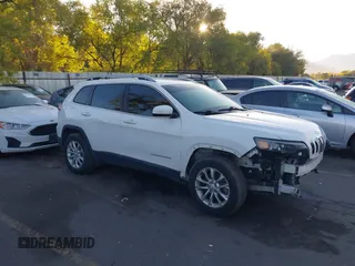 2019 Jeep Cherokee Latitude with VIN 1C4PJMCX0KD104155, listed as a IAAI auction lot 40647860 with 125,802 mi miles. Bid and sale history available at carsss.com. Image 1.