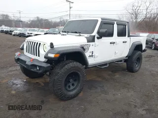 2020 Jeep Gladiator Sport S z VIN 1C6HJTAG0LL129461, wystawiony jako IAAI lot #41464713 z przebiegiem 66 625 mil mil oraz . Historia ofert i sprzedaży dostępna na DreamBid. Obrazek 19.
