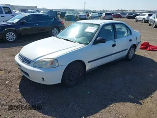 2000 Honda Civic LX with VIN 2HGEJ6673YH502410, listed as a IAAI auction lot 41992745 with 173,958 mi miles. Bid and sale history available at carsss.com. Image 17.