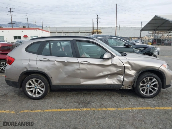 2015 BMW X1 xDrive28i with VIN WBAVL1C55FVY41749, listed as a IAAI auction lot 40977221 with 120,924 mi miles. Bid and sale history available at carsss.com. Image 6.