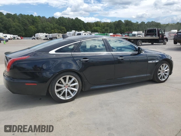 2018 Jaguar XJ with VIN SAJWA1C76J8W14271, listed as a Copart auction lot 73777914 with 124,155 mi miles and Salvage Title. Bid and sale history available at carsss.com. Image 3.