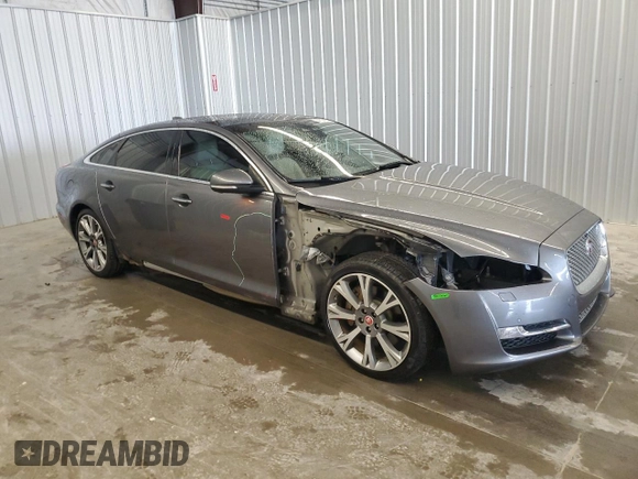 2019 Jaguar XJ Portfolio with VIN SAJWA2G71K8W19797, listed as a Copart auction lot 54133195 with 57,446 mi miles and Salvage Title. Bid and sale history available at DreamBid. Image 4.