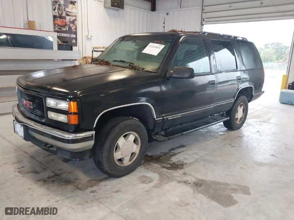 1996 GMC Yukon with VIN 1GKEK13R2TJ743987, listed as a IAAI auction lot 41652826 with 325,292 mi miles. Bid and sale history available at carsss.com. Image 2.