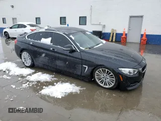 2015 BMW 4 Series 428i xDrive with VIN WBA4C9C54FD330601, listed as a Copart auction lot 45168955 with 112,408 mi miles and Salvage title. Bid and sale history available at DreamBid. Image 4.
