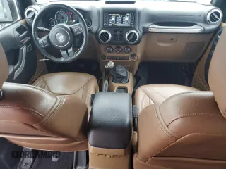 2017 Jeep Wrangler Unlimited Sahara with VIN 1C4BJWEG9HL633296, listed as a Copart auction lot 61387685 with 74,035 mi miles and Salvage title. Bid and sale history available at DreamBid. Image 8.