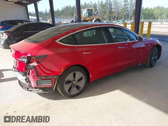 2020 Tesla Model 3 Standard Range Plus z VIN 5YJ3E1EA7LF611669, wystawiony jako IAAI lot #42179974 z przebiegiem 17 696 mil mil oraz . Historia ofert i sprzedaży dostępna na DreamBid. Obrazek 4.