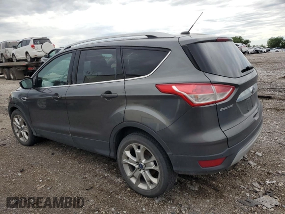 2015 Ford Escape Titanium with VIN 1FMCU9J96FUB32972, listed as a Copart auction lot 62886145 with 215,769 mi miles and Salvage title. Bid and sale history available at DreamBid. Image 2.