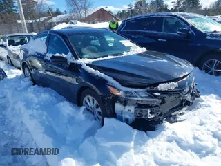 2019 Toyota Camry LE z VIN 4T1B11HK2KU185077, wystawiony jako IAAI lot #41570780 z przebiegiem 56 297 mil mil oraz . Historia ofert i sprzedaży dostępna na DreamBid. Obrazek 1.
