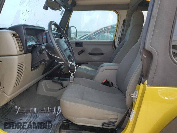 2003 Jeep Wrangler Sahara with VIN 1J4FA59S03P313418, listed as a Copart auction lot 64883094 with 184,658 mi miles and Salvage title. Bid and sale history available at DreamBid. Image 7.