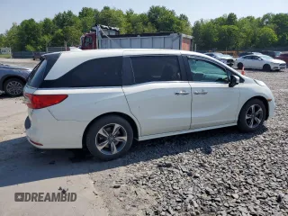 2019 Honda Odyssey Touring with VIN 5FNRL6H81KB051846, listed as a Copart auction lot 58723015 with 68,142 mi miles and Salvage title. Bid and sale history available at DreamBid. Image 3.