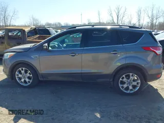2013 Ford Escape SEL with VIN 1FMCU9H98DUB89046, listed as a IAAI auction lot 41794795 with 89,819 mi miles and . Bid and sale history available at DreamBid. Image 14.