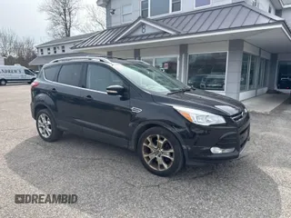 2014 Ford Escape Titanium with VIN 1FMCU9J9XEUB19527, listed as a IAAI auction lot 41956555 with 216,548 mi miles. Bid and sale history available at carsss.com. Image 1.