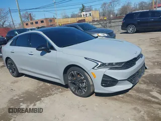 2024 Kia K5 GT-Line z VIN 5XXG64J25RG252052, wystawiony jako IAAI lot #39087311 z przebiegiem 5598 mil mil oraz . Historia ofert i sprzedaży dostępna na DreamBid. Obrazek 1.