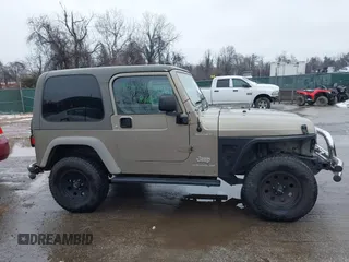 2006 Jeep Wrangler Sport Right Hand Drive with VIN 1J4F449S06P725862, listed as a IAAI auction lot 41562989 with 121,997 mi miles. Bid and sale history available at carsss.com. Image 13.
