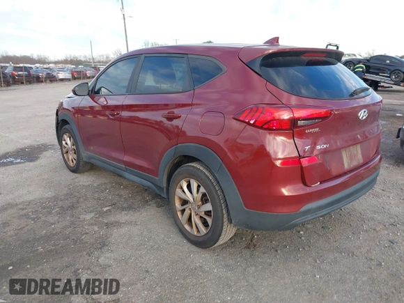 2019 Hyundai Tucson SE with VIN KM8J2CA49KU881841, listed as a IAAI auction lot 41099575 with 129,153 mi miles. Bid and sale history available at carsss.com. Image 3.