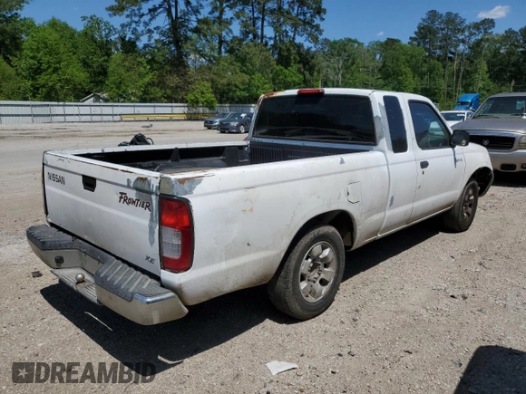 1999 Nissan Frontier XE with VIN 1N6DD26S3XC326231, listed as a Copart auction lot 51710615 with 228,174 mi miles and Salvage title. Bid and sale history available at DreamBid. Image 3.