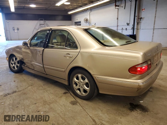 2002 Mercedes-Benz E-Class with VIN WDBJF65J12B485293, listed as a Copart auction lot 77561984 with 140,708 mi miles and Salvage Title. Bid and sale history available at carsss.com. Image 2.
