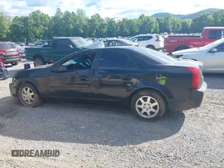 2007 Cadillac CTS z VIN 1G6DP577270133840, wystawiony jako IAAI lot #42301505 z przebiegiem Nie podano mil oraz . Historia ofert i sprzedaży dostępna na DreamBid. Obrazek 14.